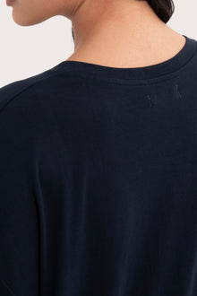 Back view details of the Yara Top Navy highlighting the garment shape and drape.