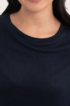 Close up front  of the Yara Top Navy highlighting craftsmanship and design features.