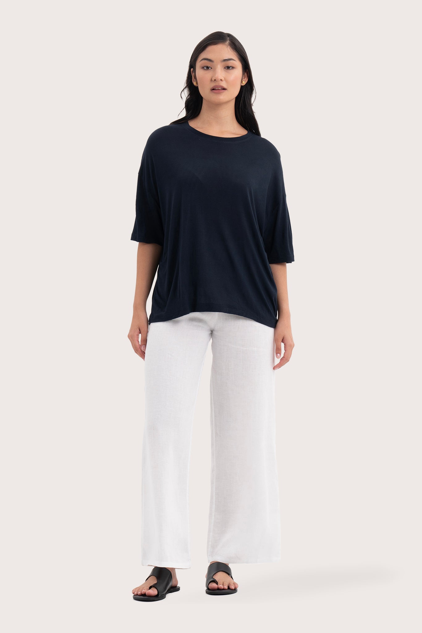 Front view of the Yara Top Navy showcasing its silhouette and relaxed fit.