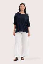 Front view of the Yara Top Navy showcasing its silhouette and relaxed fit.
