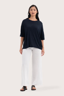 Front view of the Yara Top Navy showcasing its silhouette and relaxed fit.