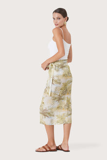 Side profile of the Zaree Linen Skirt The Island showing its cut and natural movement