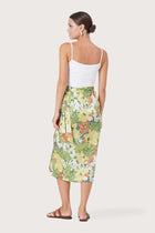 Back view of the Zaree Linen Skirt Tropis highlighting the garment shape and drape