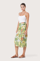 Side profile of the Zaree Linen Skirt Tropis showing its cut and natural movement