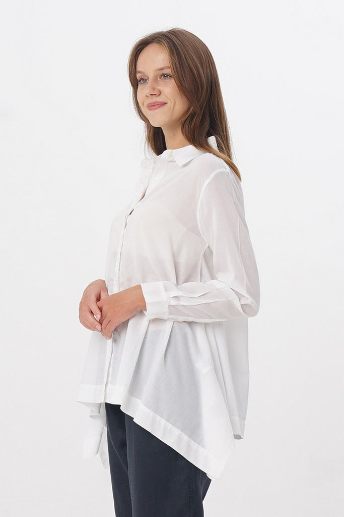 Woman with white Flowy Shirt side view