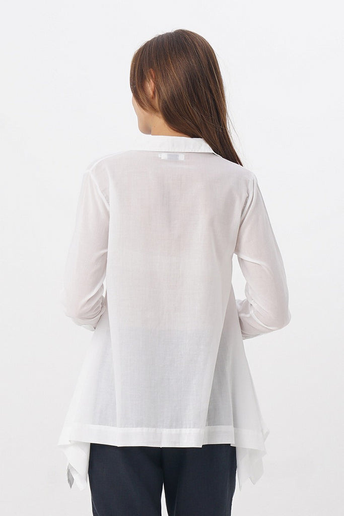 Woman with white Flowy Shirt back view