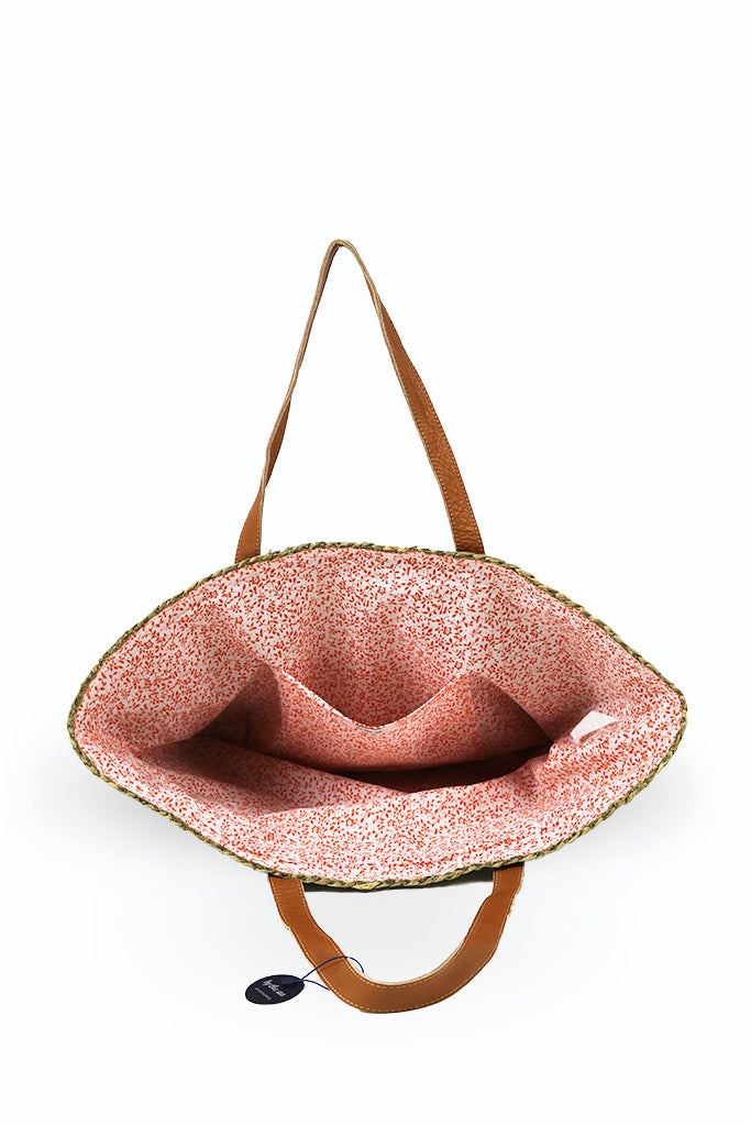 Interior view of the Natural Straw Tote Bag showcasing practical storage and thoughtful organization